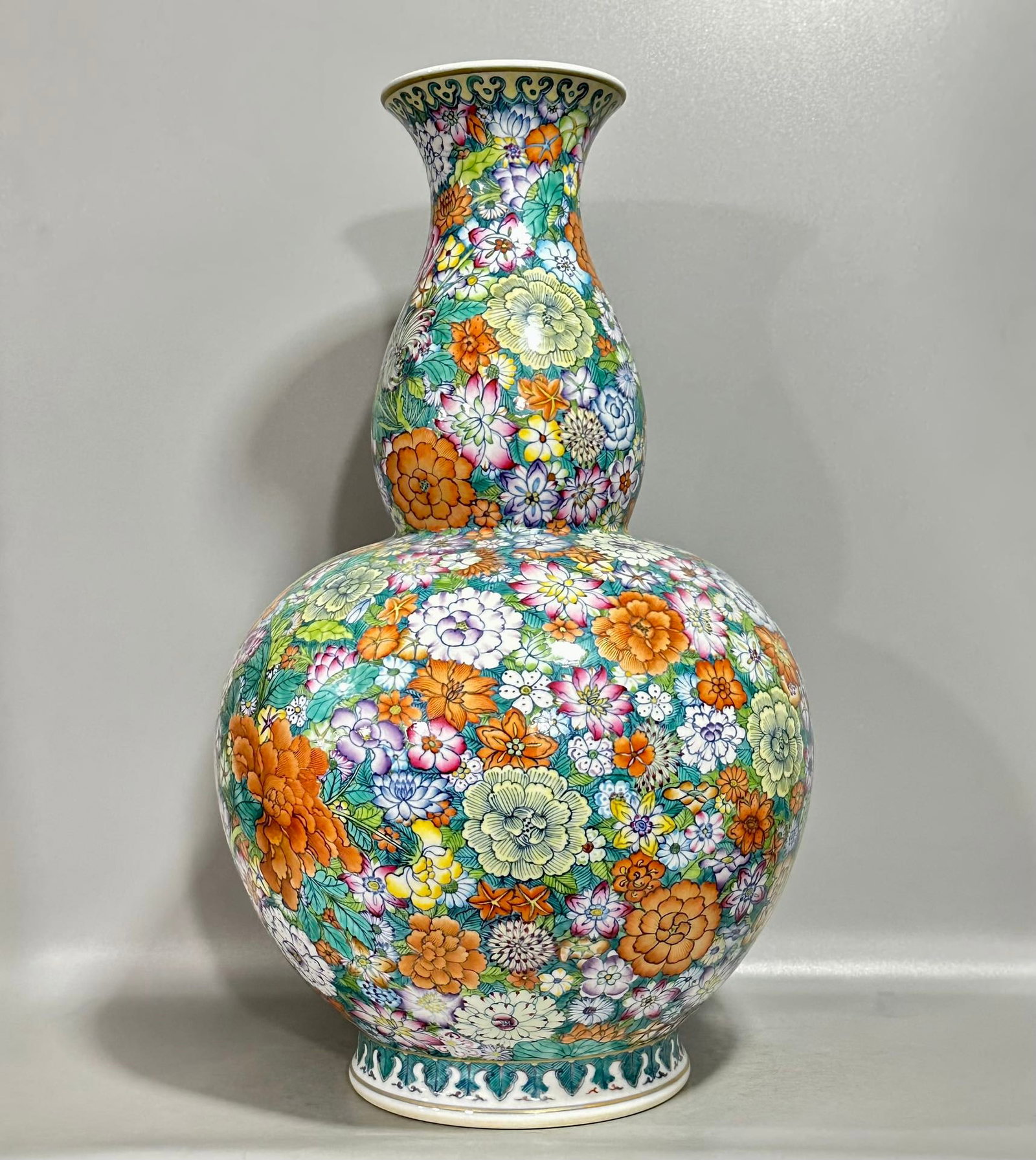 An Exquisite Chinese blue and white gourd vase with multi-coloured patterns and ten thousand flowers: Size: Height 49 cm - Width 30 cm |Materials: Porcelain |Dynasty: Qing dynasty |Inscription: Qianlong Mark |Object: vase