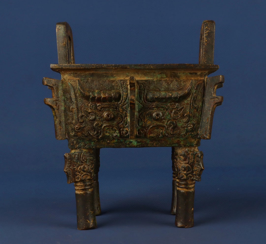 An Exquisite Chinese Bronze animal faced square tripod: Size: Height 18 cm - Width 14 cm Materials: Bronze Dynasty: zhou dynasty Attribution: 700-BC Object: Bell