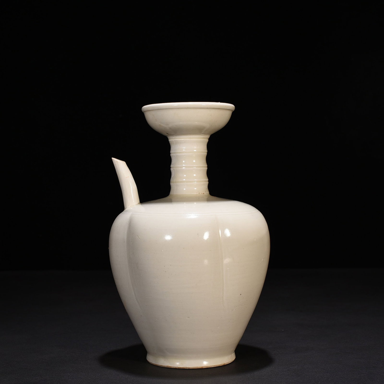 An Exquisite Chinese Ding kiln melon-shaped teapot: Size: Height 25 cm - Widthh 11 cm Materials: Porcelain Dynasty: Song Dynasty Attribution: 10th-C period Object: teapot