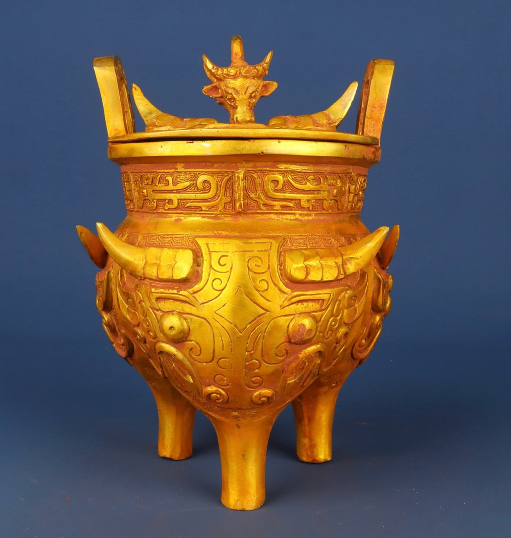 An Exquisite Chinese Bronze gilt animal faced tripod: Size: Height 22 cm - Width 16 cm Materials: Bronze Dynasty: zhou dynasty Attribution: 700-BC Object: Bell
