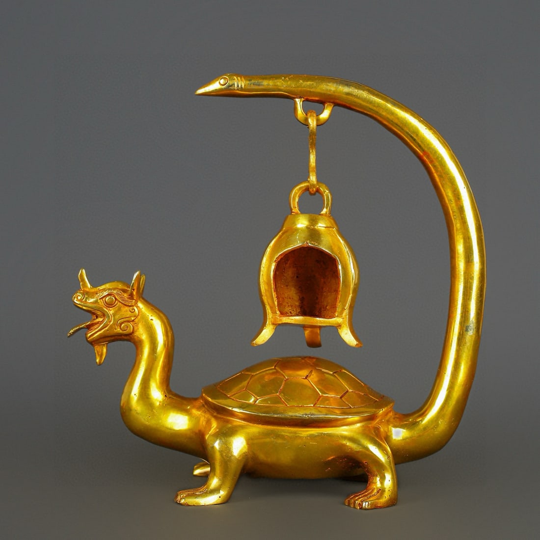 An Exquisite Chinese gilt bronze dragon and turtle lampstand: Size: Height 28 cm - Width 27 cm Materials: Bronze Dynasty: Han dynasty Attribution: 1st to 3rd-C Object: Bell