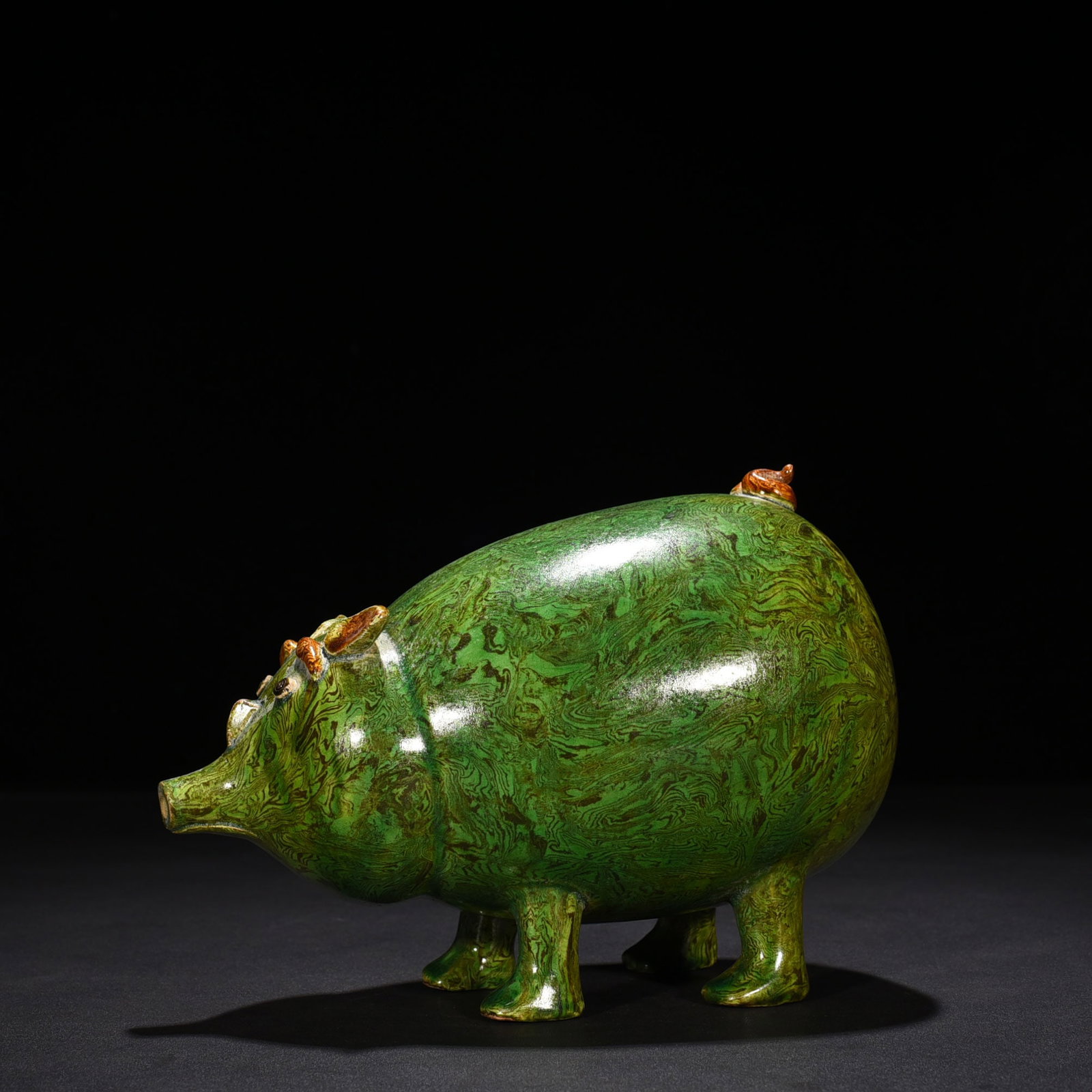 An Exquisite Chinese Kiln Green-glazed twisted fetal pig statue: Size: Height 15 cm - Widthh 20 cm Materials: Porcelain Dynasty: Song Dynasty Attribution: 10th-C period Object: statue
