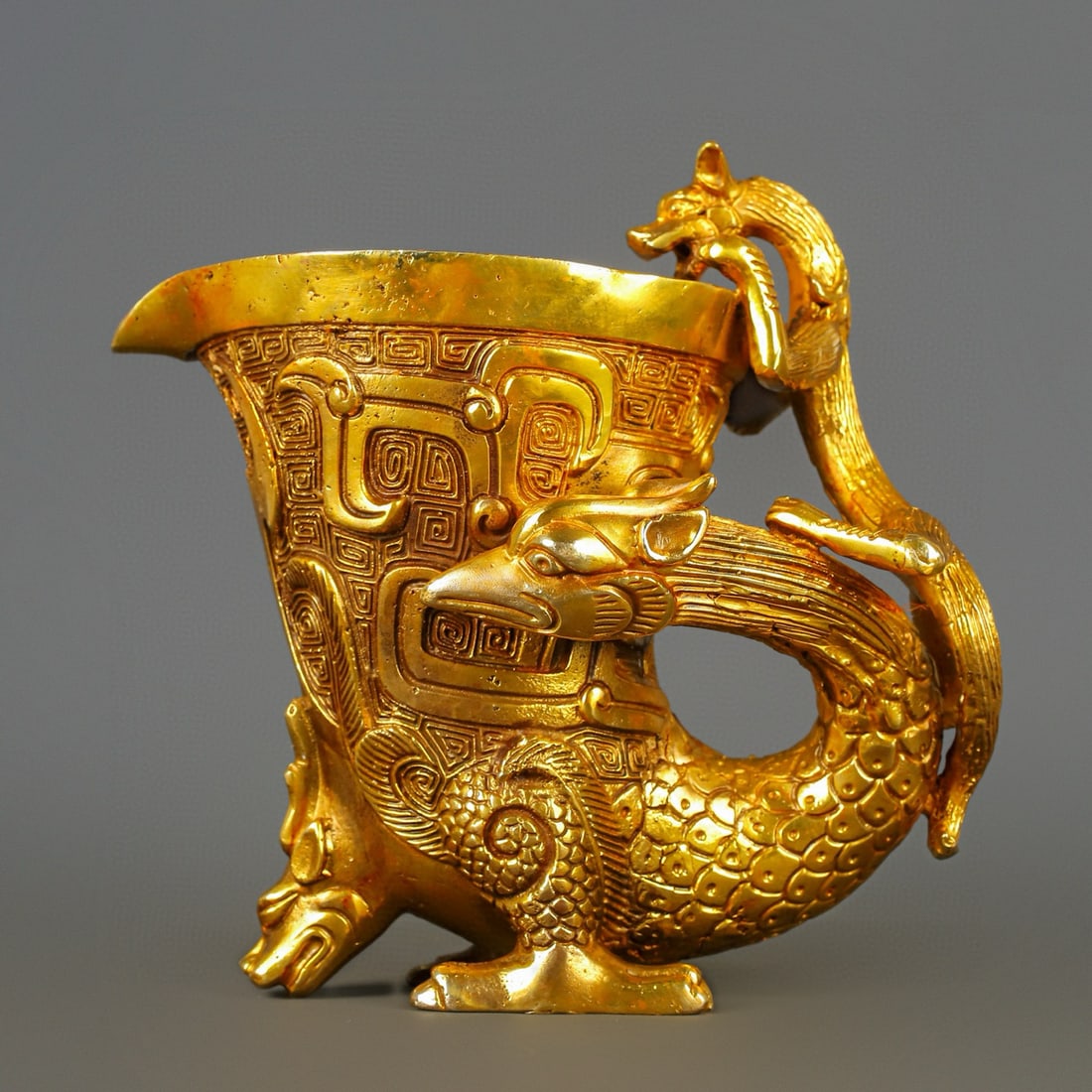 An Exquisite Chinese gilt bronze dragon and phoenix cup: Size: Height 25 cm - Width 25 cm Materials: Bronze Dynasty: Han dynasty Attribution: 1st to 3rd-C Object: Bell