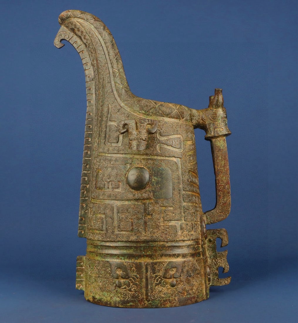 An Exquisite Chinese Bronze double dragon animal face vessel: Size: Height 42 cm - Width 23 cm Materials: Bronze Dynasty: zhou dynasty Attribution: 700-BC Object: Bell