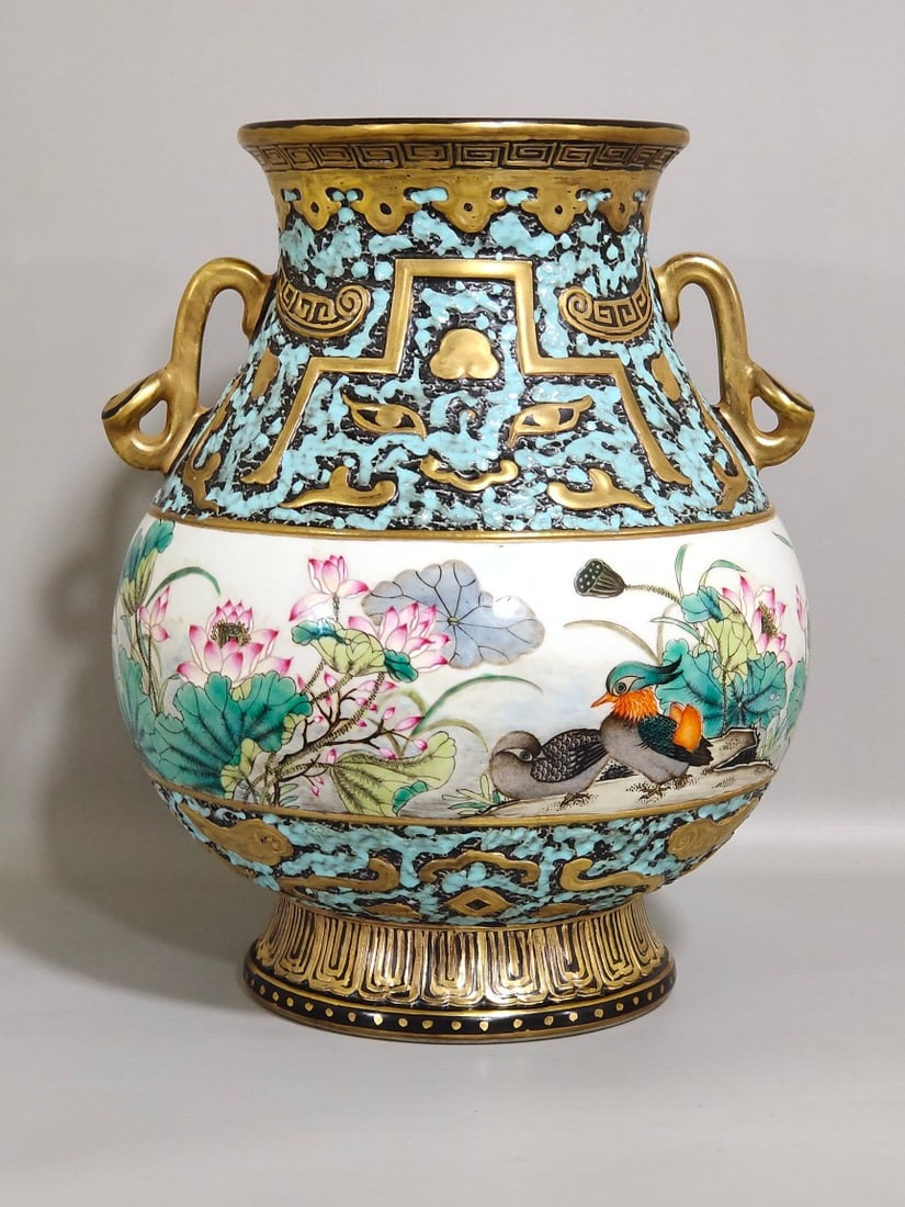 An Exquisite Chinese bronze colored mandarin duck playing in the water lotus double-eared statue: Size: Height 24.5 cm - Width 19 cm Materials: Porcelain Dynasty: Qing dynasty Inscription: Qianlong Mark Object: vase