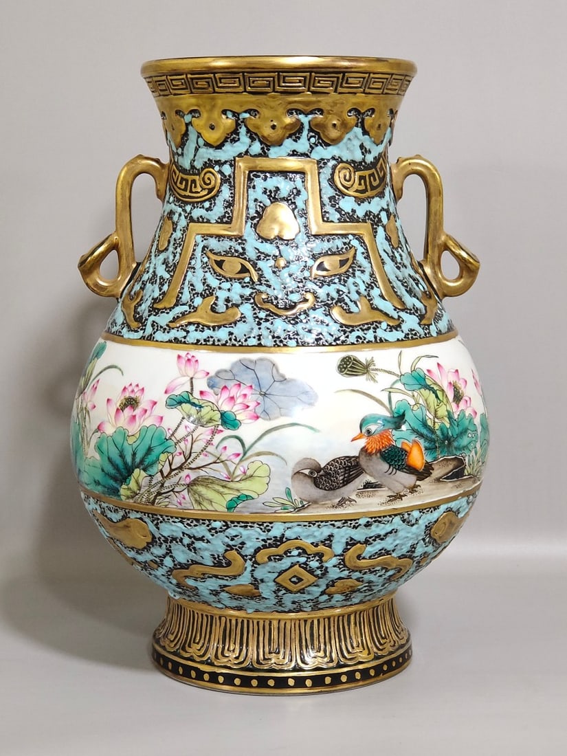 An Exquisite Chinese bronze colored mandarin duck playing in the water lotus double-eared statue: Size: Height 27 cm - Width 18 cm Materials: Porcelain Dynasty: Qing dynasty Inscription: Qianlong Mark Object: vase