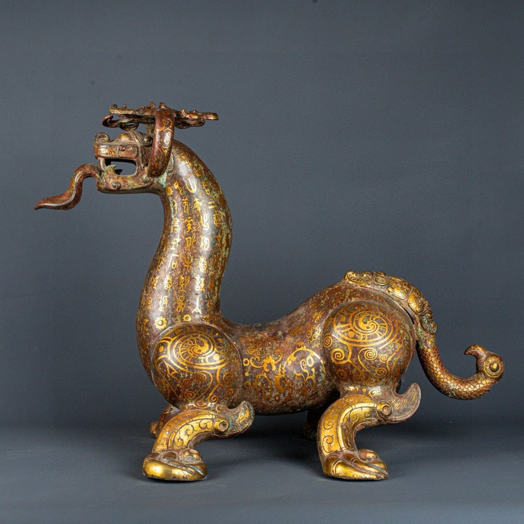 An Exquisite Chinese Bronze and gold inscribed auspicious beasts: Size: Height 57 cm - Width 80 cm Materials: Bronze Dynasty: Han dynasty Attribution: 1st to 3rd-C Object: Bell