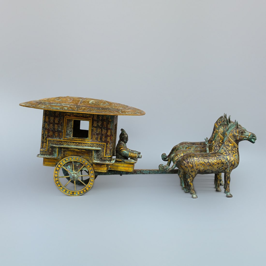 An Exquisite Chinese Bronze and gold horse drawn cart: Size: Height 32 cm - Width 85 cm Materials: Bronze Dynasty: Han dynasty Attribution: 1st to 3rd-C Object: Bell