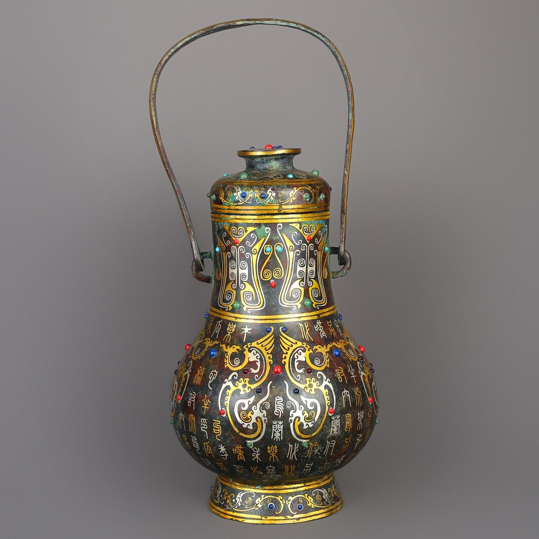 An Exquisite Chinese Bronze and gold inlaid handle: Size: Height 49 cm - Width 20 cm Materials: Bronze Dynasty: Han dynasty Attribution: 1st to 3rd-C Object: Bell