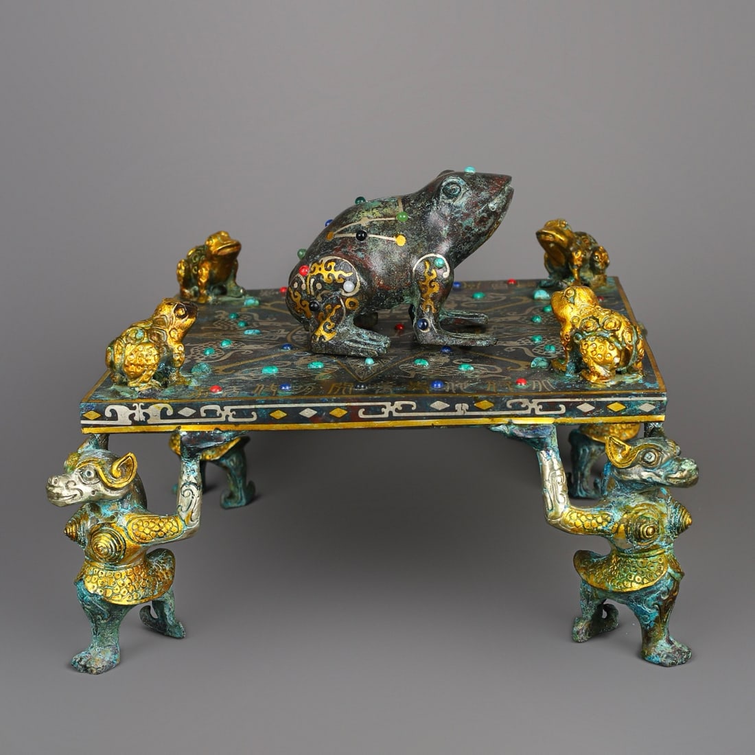 An Exquisite Chinese Bronze and gold inlaid frog square compass: Size: Height 19 cm - Width 27 cm Materials: Bronze Dynasty: Han dynasty Attribution: 1st to 3rd-C Object: Bell