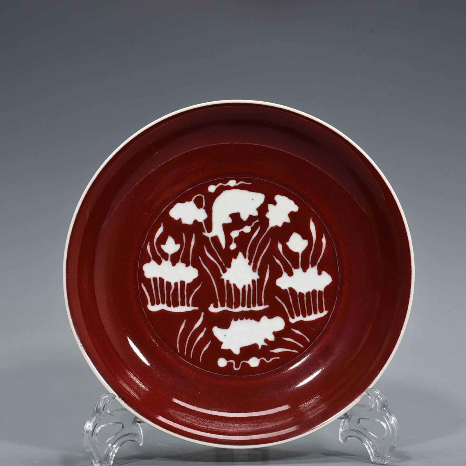 An Exquisite Chinese red glaze engraved plate: Size: Height 4 cm - Widthh 22 cm Materials: Porcelain Dynasty: Ming Dynasty Attribution: Xuande Mark Object: plate