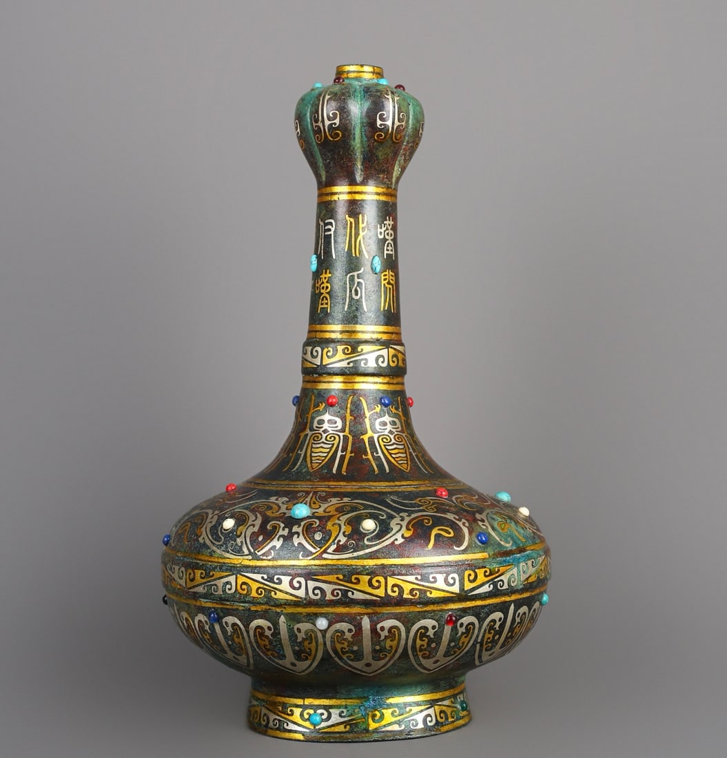 An Exquisite Chinese Bronze and gold inlaid garlic bottle: Size: Height 30 cm - Width 17 cm Materials: Bronze Dynasty: Han dynasty Attribution: 1st to 3rd-C Object: Bell