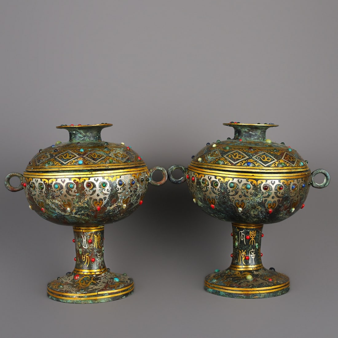 An Exquisite Chinese A pair of bronze and gold round beans: Size: Height 23 cm - Width 22 cm Materials: Bronze Dynasty: Han dynasty Attribution: 1st to 3rd-C Object: Bell