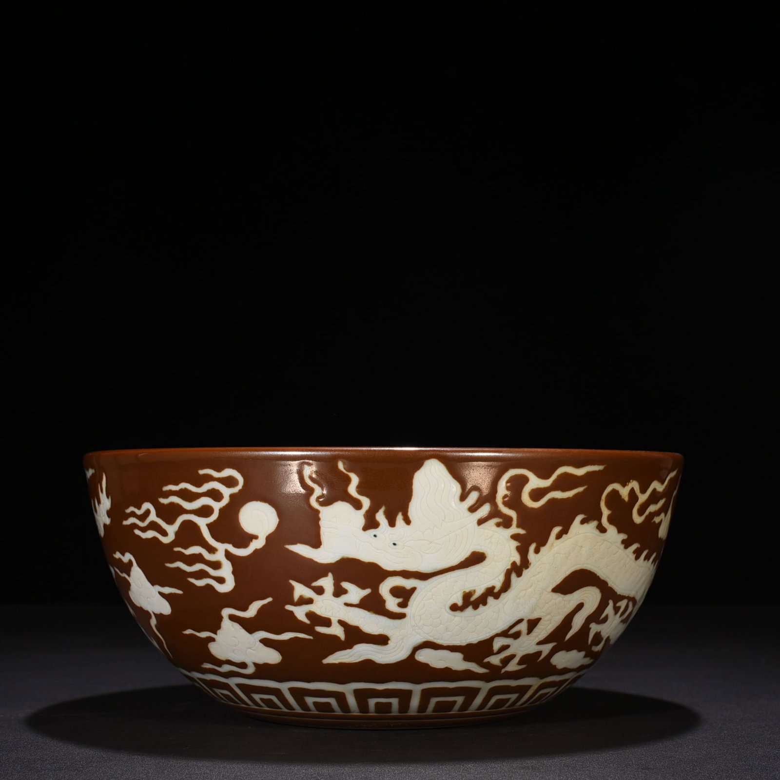 An Exquisite Chinese purple gold glaze engraved dragon bowl: Size: Height 12 cm - Widthh 24 cm Materials: Porcelain Dynasty: Ming Dynasty Attribution: Xuande Mark Object: bowl