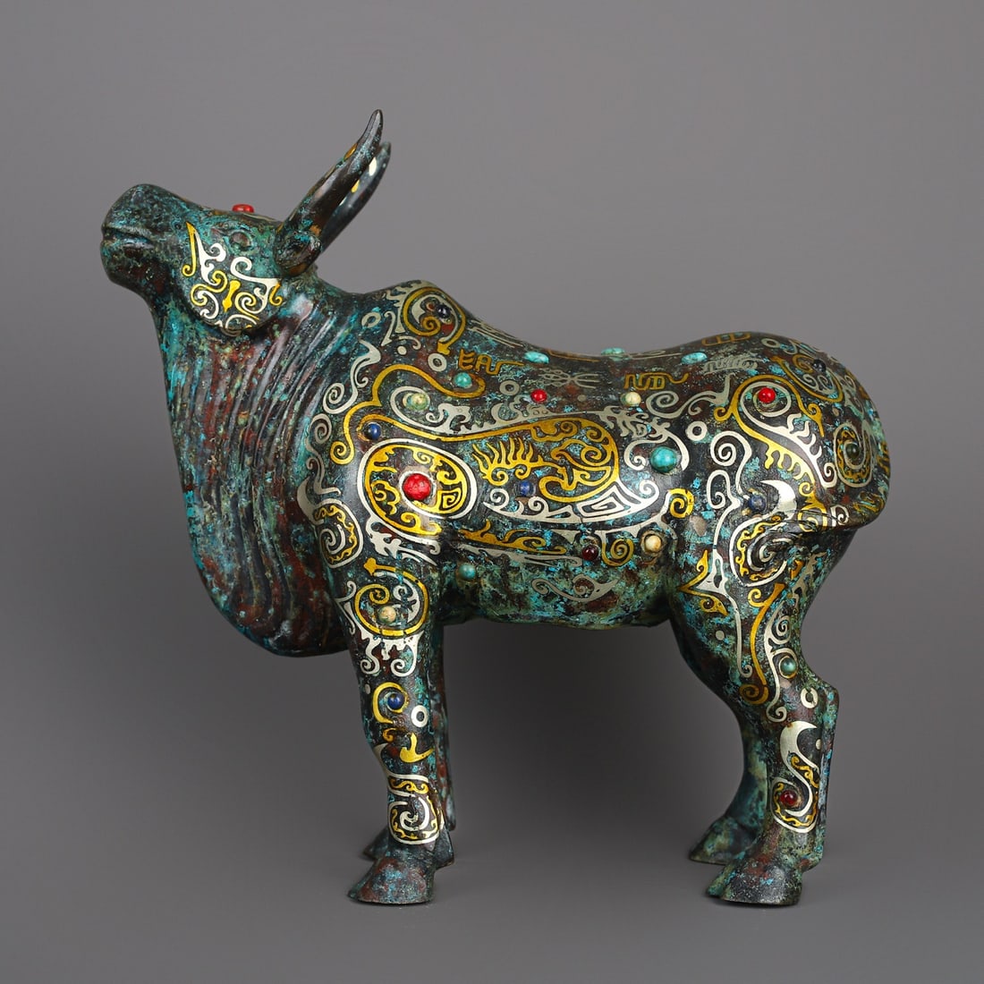 An Exquisite Chinese Bronze and gold inlaid cow: Size: Height 25 cm - Width 26 cm Materials: Bronze Dynasty: Han dynasty Attribution: 1st to 3rd-C Object: Bell