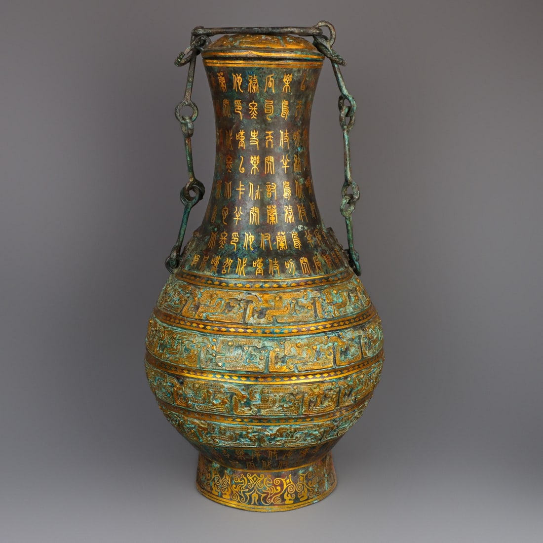 An Exquisite Chinese Bronze and gold chain bottle: Size: Height 54 cm - Width 26 cm Materials: Bronze Dynasty: Han dynasty Attribution: 1st to 3rd-C Object: Bell