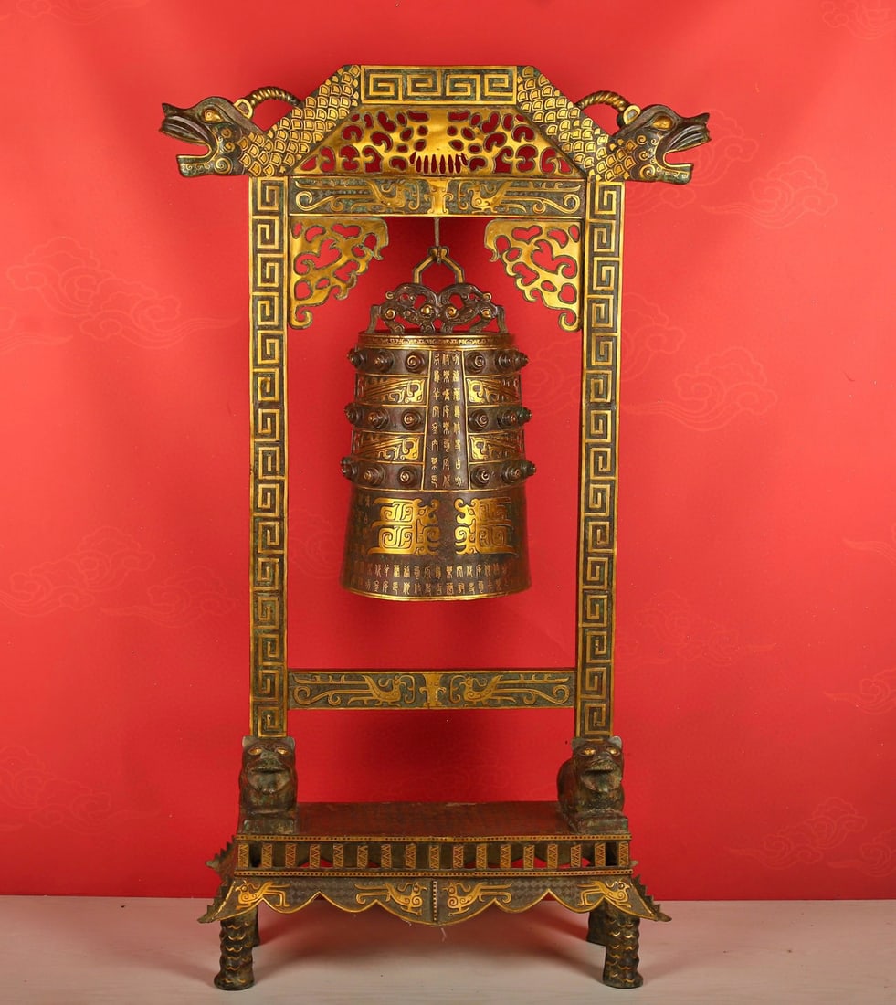 An Exquisite Chinese Bronze and gold double dragon wall clock: Size: Height 150 cm - Width 90 cm Materials: Bronze Dynasty: Han dynasty Attribution: 1st to 3rd-C Object: Bell