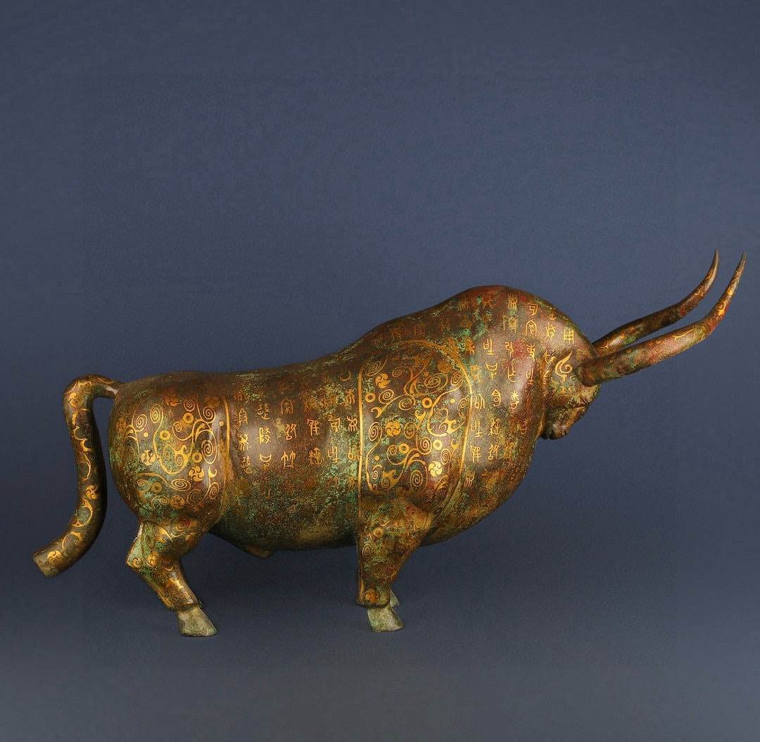 An Exquisite Chinese Bronze bull with gold and silver inscriptions: Size: Height 34 cm - Width 69 cm Materials: Bronze Dynasty: Han dynasty Attribution: 1st to 3rd-C Object: Bell