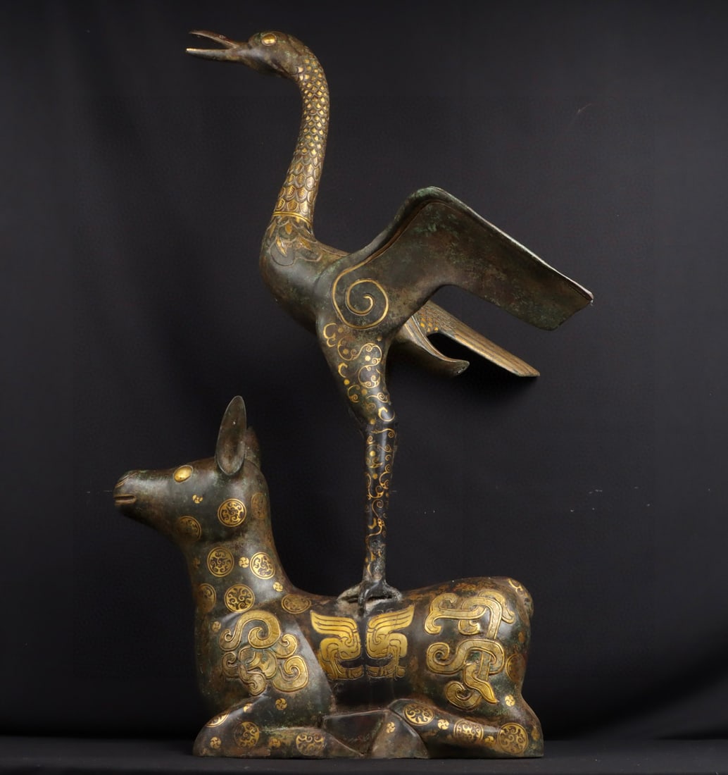An Exquisite Chinese Bronze and gold deer and crane: Size: Height 105 cm - Width 62 cm Materials: Bronze Dynasty: Han dynasty Attribution: 1st to 3rd-C Object: Bell