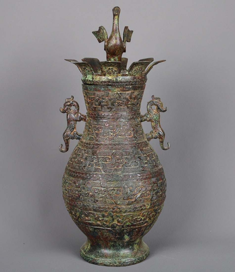 An Exquisite Chinese Bronze Standing Bird and Double Dragon Vase: Size: Height 39 cm - Width 17 cm Materials: Bronze Dynasty: Han dynasty Attribution: 1st to 3rd-C Object: Chinese Antiques