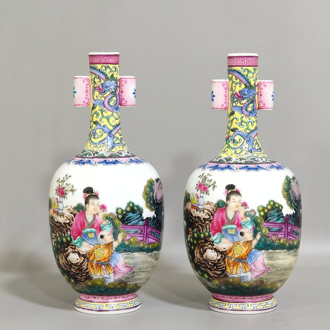 An Exquisite Chinese enamel double-eared vase with a picture of a lady with a belt: Size: Height 17 cm - Width 7.5 cm Materials: Porcelain Dynasty: Qing dynasty Inscription: Qianlong Mark Object: vase