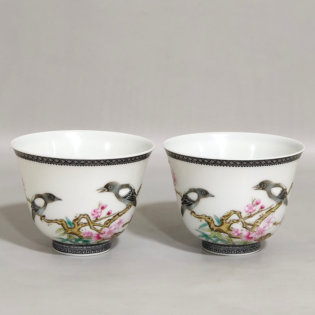 An Exquisite Chinese enamel ink-rimmed cup with poemsAnd flowersAnd birds: Size: Width 6.7 cm - Height 4.9 cm Materials: Porcelain Dynasty: Qing dynasty Inscription: Qianlong Mark Object: cup
