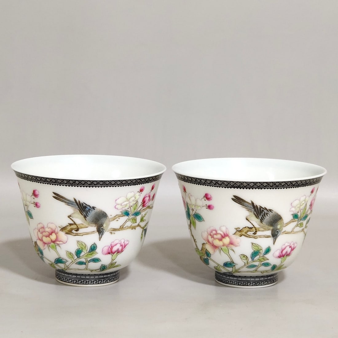 An Exquisite Chinese enamel ink-rimmed cup with poemsAnd flowersAnd birds: Size: Width 6.7 cm - Height 4.9 cm Materials: Porcelain Dynasty: Qing dynasty Inscription: Qianlong Mark Object: cup