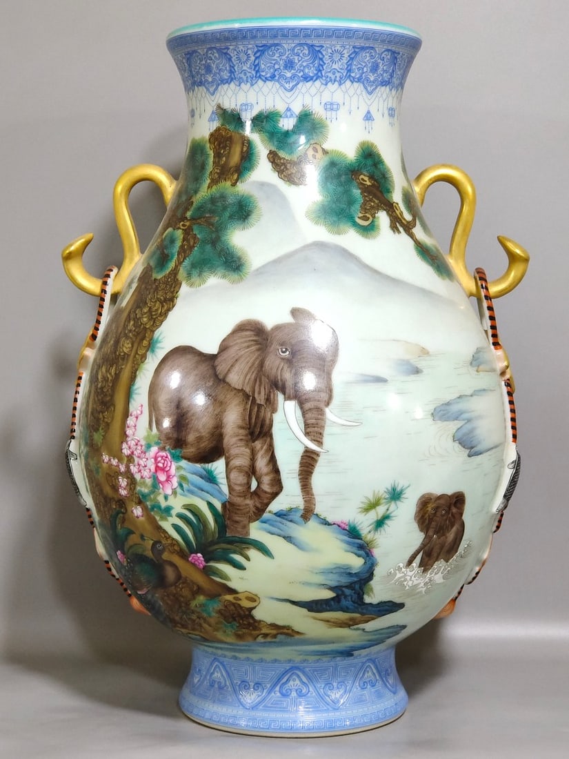 An Exquisite Chinese enamel Taiping statue with elephantsAnd two ears: Size: Height 41 cm - Width 25 cm Materials: Porcelain Dynasty: Qing dynasty Inscription: Qianlong Mark Object: vase