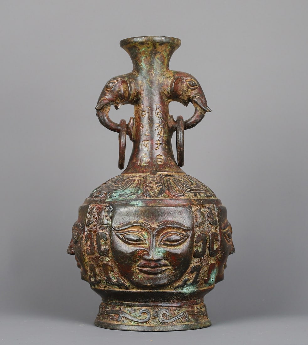 An Exquisite Chinese Bronze human faced round kettle (1 of 9)