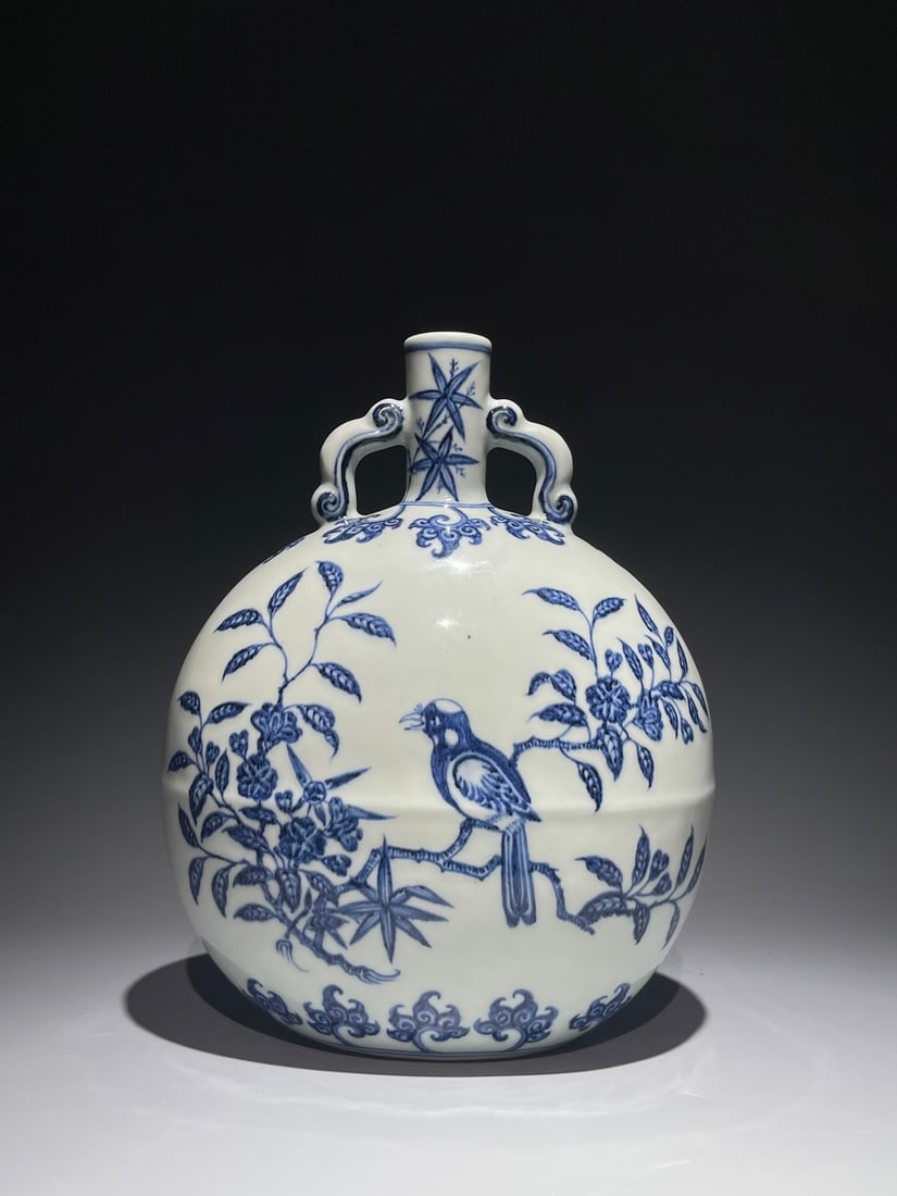 An Exquisite Chinese Blue and White Flower and Bird Pattern Ribbon Ear Holding Moon Porcelain vase: Size: Height 29.5 cm - Width 23 cm Materials: Porcelain Dynasty: Ming dynasty Attribution: Xuande Period Object: Vase