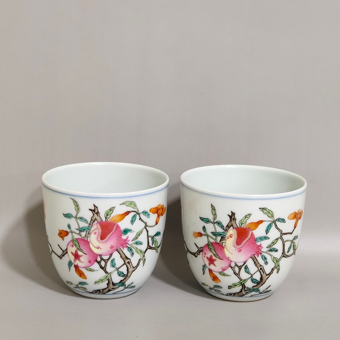 An Exquisite Chinese A pair of pomegranate pattern cups: Size: Width 6.5 cm - Height 6 cm Materials: Porcelain Dynasty: Qing dynasty Inscription: Qianlong Mark Object: cup