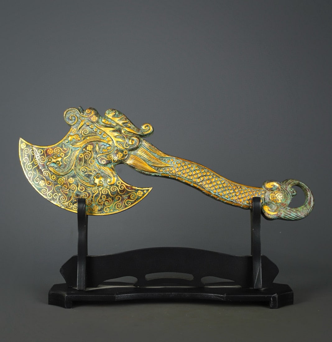 An Exquisite Chinese Bronze and gold axe: Size: Height 49 cm - Width 18.5 cm Materials: Bronze Dynasty: Han dynasty Attribution: 1st to 3rd-C Object: Chinese Antiques