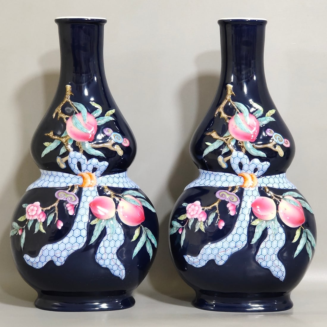 An Exquisite Chinese Festival blue glazed relief vase with longevity peach gourd: Size: Height 27.7 cm - Width 13.5 cm Materials: Porcelain Dynasty: Qing dynasty Inscription: Qianlong Mark Object: vase