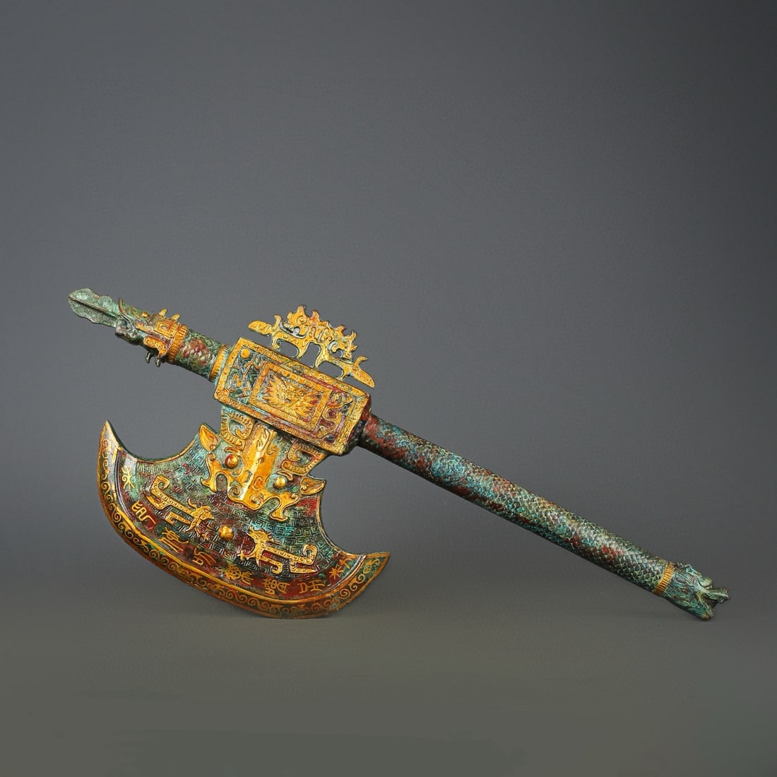 An Exquisite Chinese Bronze and gold inlaid animal faced axe (1 of 10)