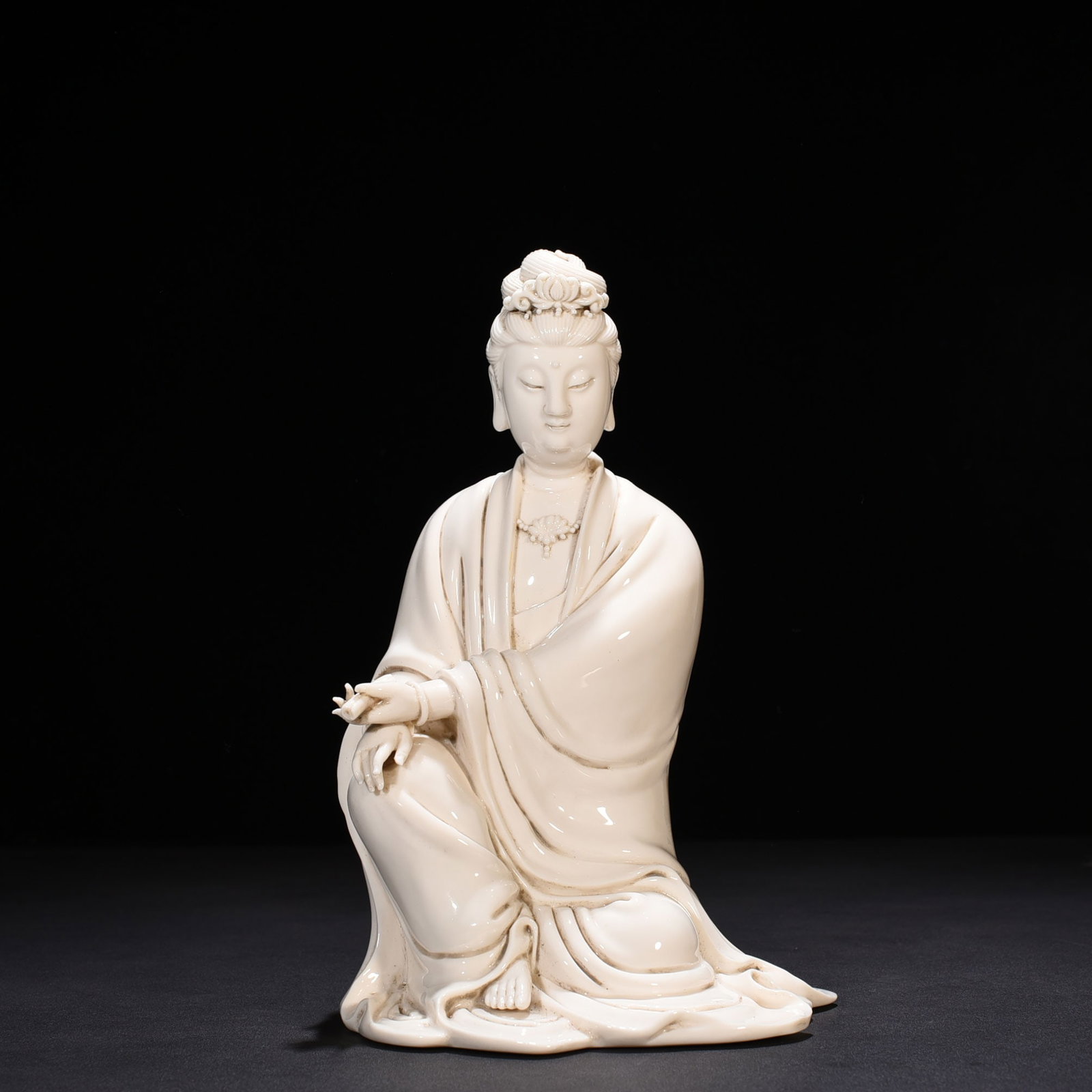 An Exquisite Chinese Dehua ware Guanyin figure with the mark of He Chaozong: Size: Height 27 cm - Widthh 15 cm Materials: Porcelain Dynasty: Ming dynasty Attribution: 15th-c Object: Statue