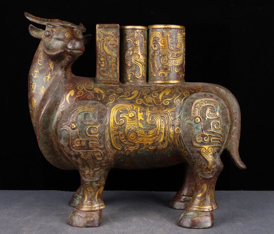 An Exquisite Chinese Niu Zun with bronze and gold inscriptions: Size: Height 32 cm - Width 35 cm Materials: Bronze Dynasty: Han dynasty Attribution: 1st to 3rd-C Object: Chinese Antiques
