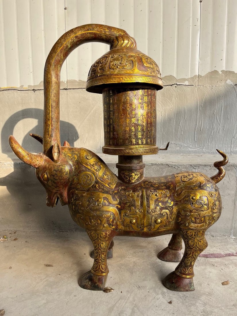 An Exquisite Chinese Bronze and gold bull lamp: Size: Height 116 cm - Width 100 cm Materials: Bronze Dynasty: Han dynasty Attribution: 1st to 3rd-C Object: Chinese Antiques