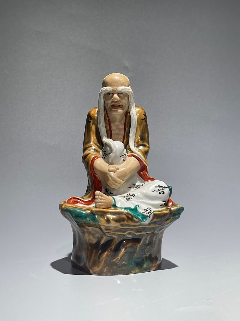 An Exquisite Chinese Zhengu Arhat with Long Eyebrows Porcelain sculpture Statue: Size: Height 13 cm - Width 8.5 cm Materials: Porcelain Dynasty: Ming Dynasty Attribution: Zhengu Period Object: statue