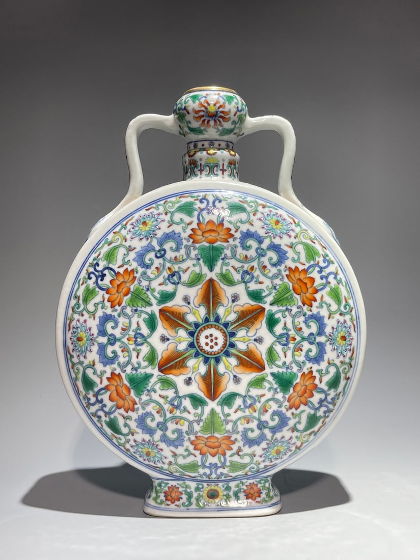 An Exquisite Chinese Famille Rose colorful ribbons and earrings with colorful branchesa flat: Size: Height 29.5 cm - Width 21 cm Materials: Porcelain Dynasty: Qing Dynasty Attribution: Qianlong Period Object: Vase