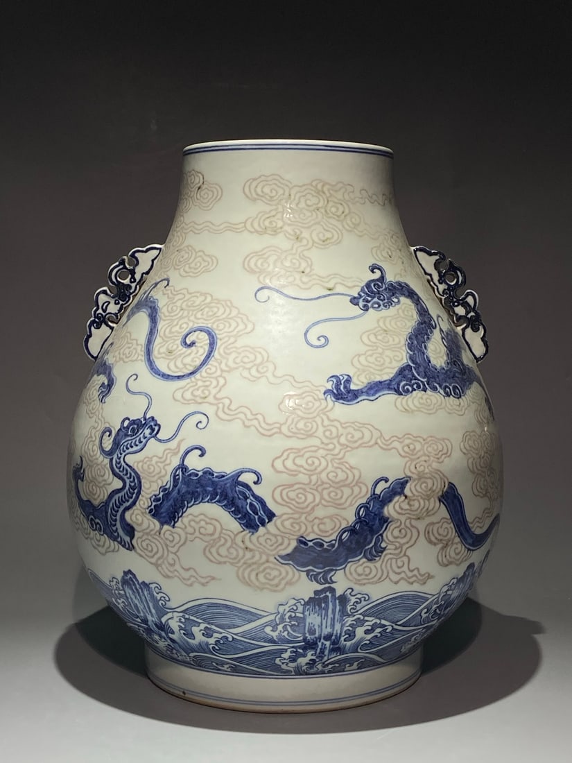 An Exquisite Chinese blue and white underglaze red cloud and dragon pattern double eared Porcelain: Size: Height 45 cm - Width 37 cm Materials: Porcelain Dynasty: Qing Dynasty Attribution: Qianlong Period Object: jar