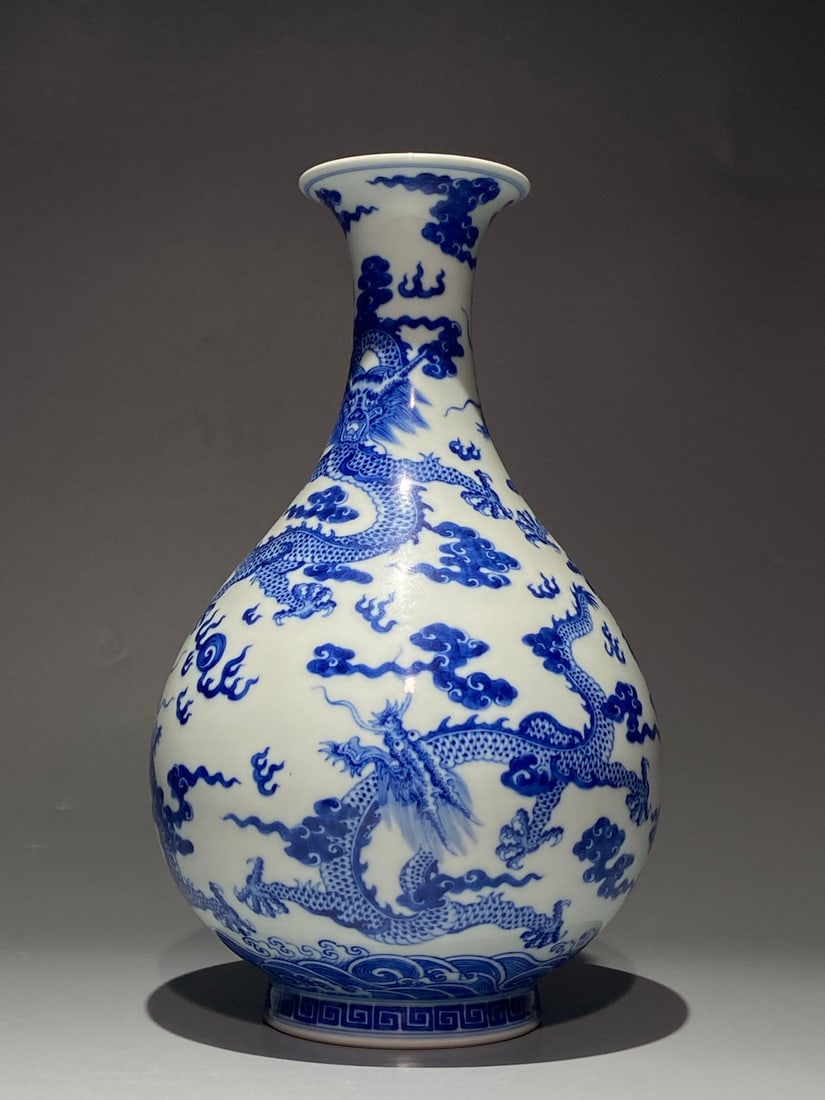 An Exquisite Chinese blue and white jadePorcelain pot with cloud and dragon pattern Porcelain vase: Size: Height 31.5 cm - Width 19 cm Materials: Porcelain Dynasty: Qing Dynasty Attribution: Qianlong Period Object: vase