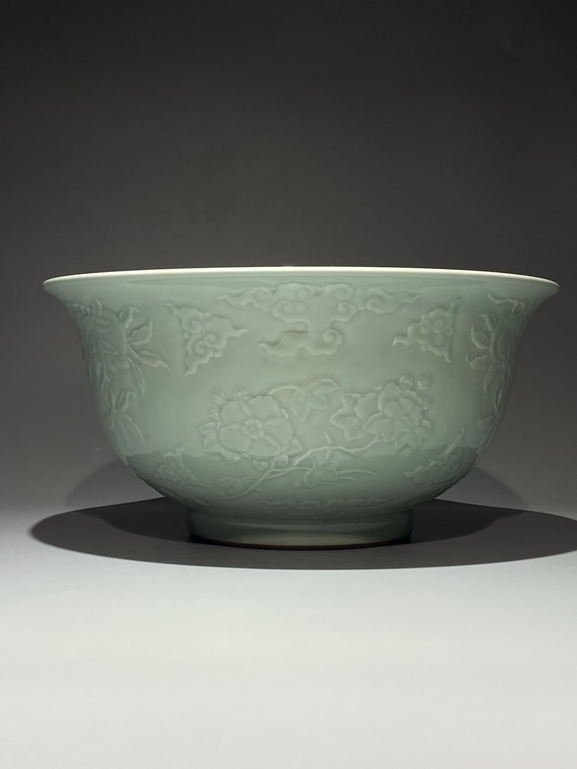 An Exquisite Chinese green glaze engraved with branches and flower Porcelain bowl: Size: Width 34 cm - Height 16.5 cm Materials: Porcelain Dynasty: Qing Dynasty Attribution: Yongzheng Period Object: bowl