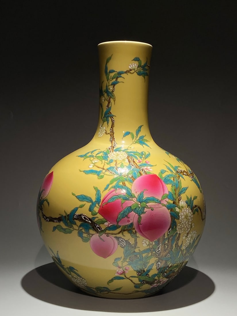 An Exquisite Chinese famille rose yellow ground pastel nine peach celestial sphere Porcelain vase: Size: Height 54.5 cm - Width 39 cm Materials: Porcelain Dynasty: Qing Dynasty Attribution: Qianlong Period Object: vase
