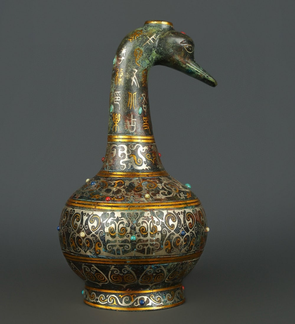 An Exquisite Chinese Bronze gold and silver inlaid turquoise duck head vase: Size: Height 30 cm - Width 16 cm Materials: Bronze Dynasty: Han dynasty Attribution: 1st to 3rd-C Object: Chinese Antiques