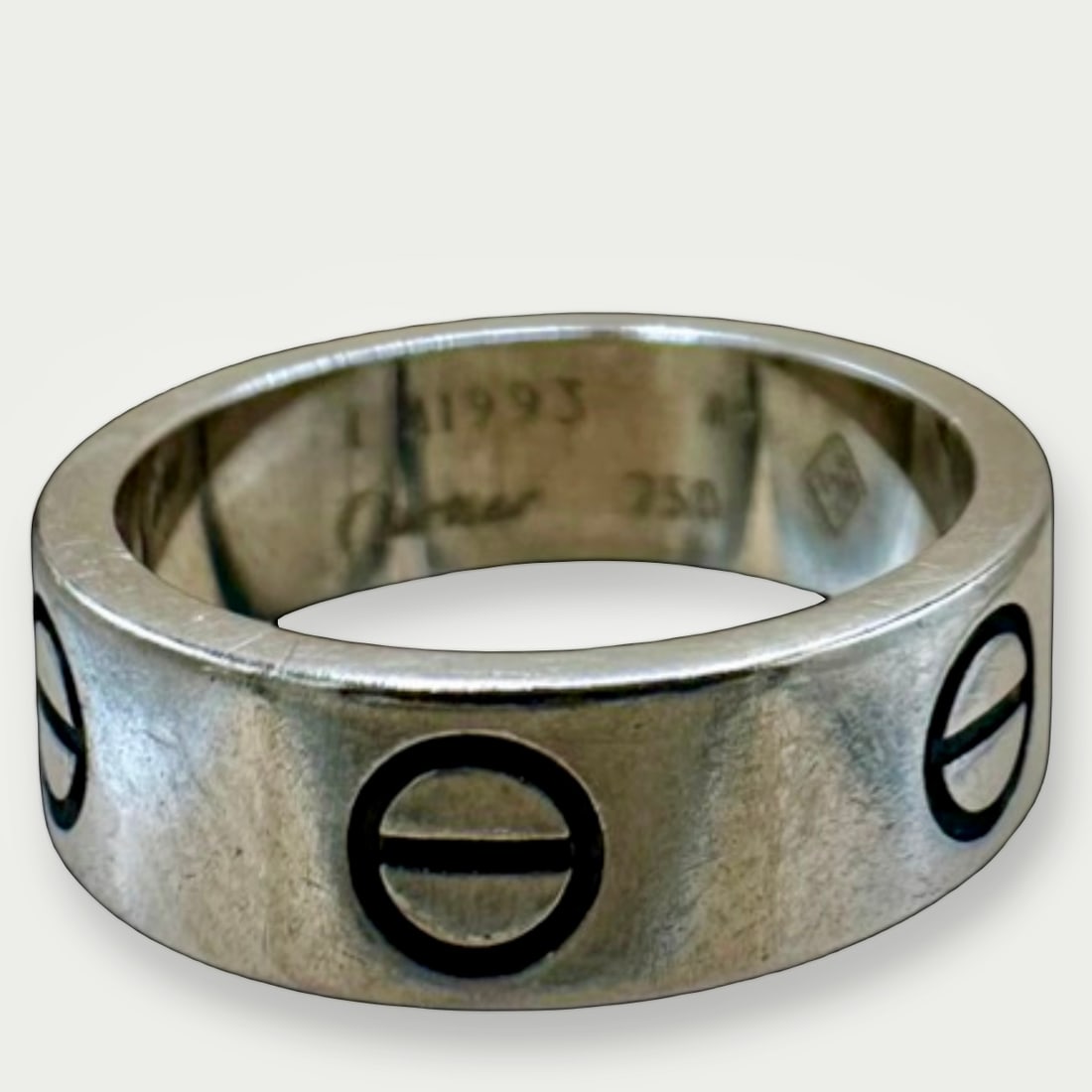 CARTIER Love Ring, Classic Model, 18K White Gold, EU Size 49 (US 4.75): An enduring expression of Cartier's Love collection, this Classic Model ring reflects the clean geometry and signature screw motif that have defined the design for generations. Offered in EU size 49, 