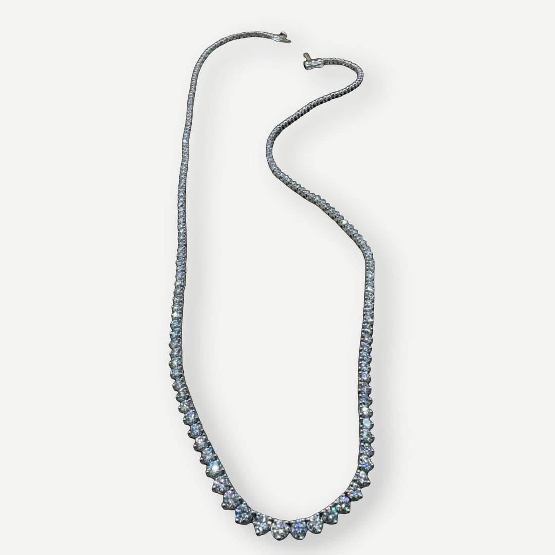 Designer Diamond Riviera Tennis Necklace, 6 Carats: A classic Helzberg diamond Riviera tennis necklace in 10K white gold, set with 6.0 carats total weight of round lab grown diamonds. The continuous line of diamonds creates the refined brilliance and f