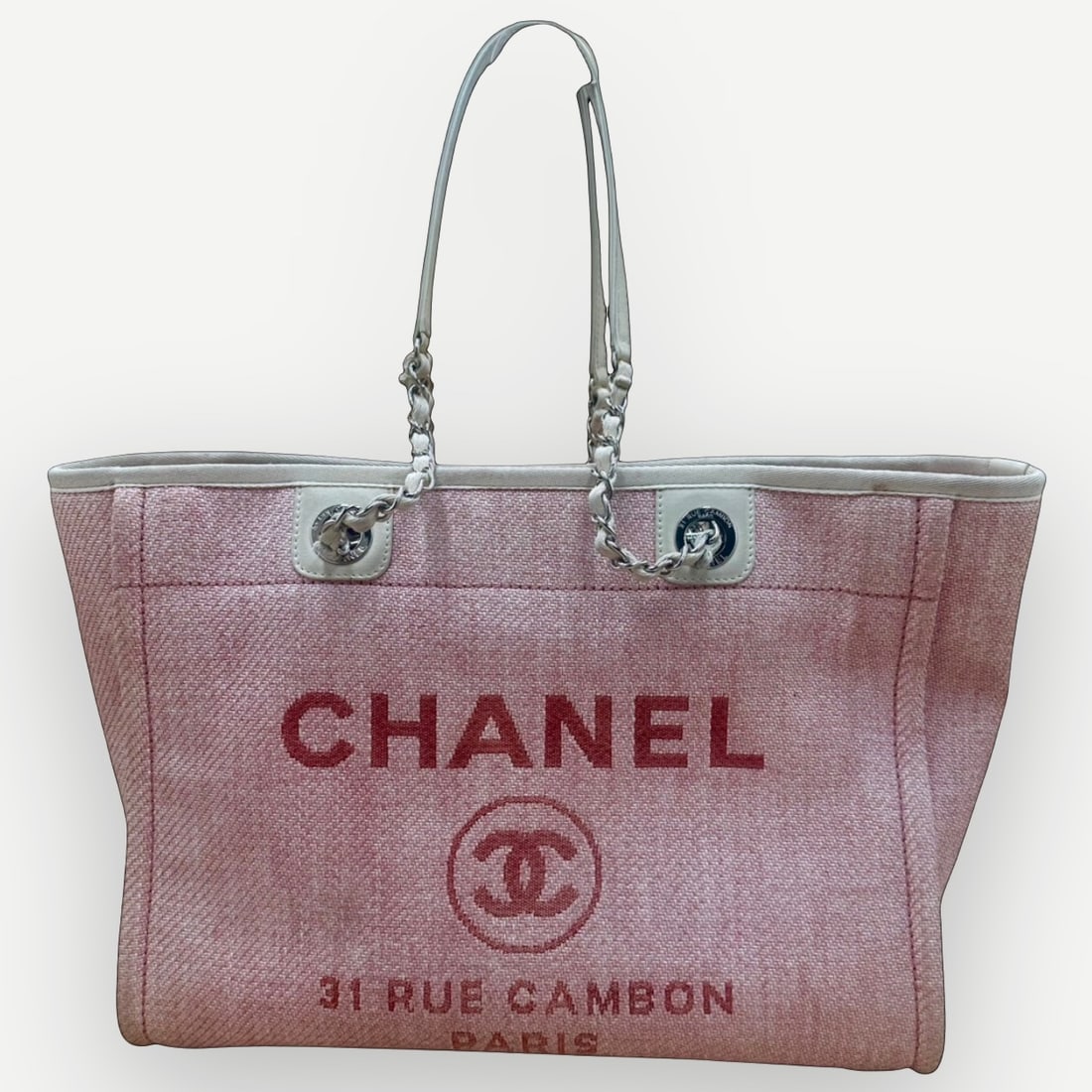 CHANEL Deauville Large Shopping Tote, Pink Tweed Canvas, Silver Tone Hardware: The CHANEL Deauville Shopping Tote has become one of the HouseÕs defining contemporary handbag designs, recognized for its relaxed silhouette and everyday versatility. Seasonal colorways and larger f