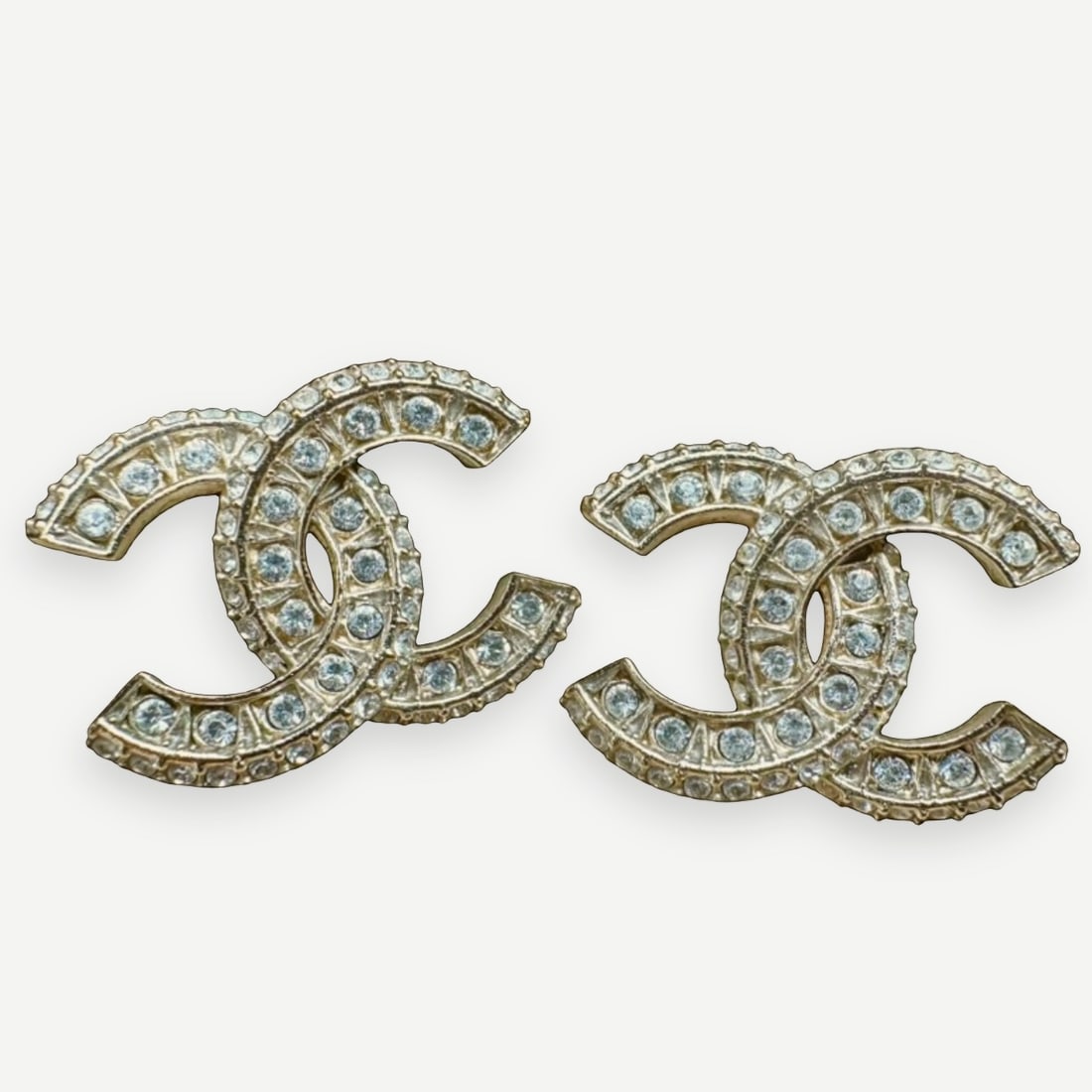 CHANEL Classic CC Stud Earrings, Crystal-Embellished, Gold-Tone, Full Set: Among ChanelÕs most enduring jewelry designs, these Classic CC stud earrings feature the HouseÕs iconic interlocking CC motif beautifully embellished with brilliant clear crystals set within