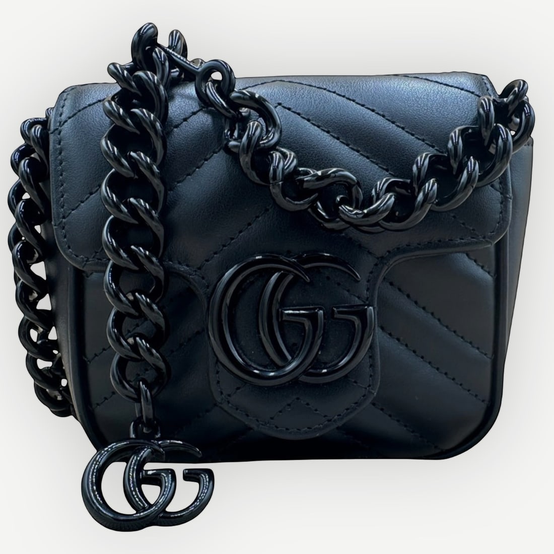 GUCCI GG Marmont Super Mini Shoulder Bag, Black MatelassŽ Leather, Black Hardware, With: An unmistakable symbol of modern Gucci design, the GG Marmont Super Mini Shoulder Bag combines the HouseÕs signature chevron matelassŽ leather with the iconic interlocking GG emblem in an elegant to
