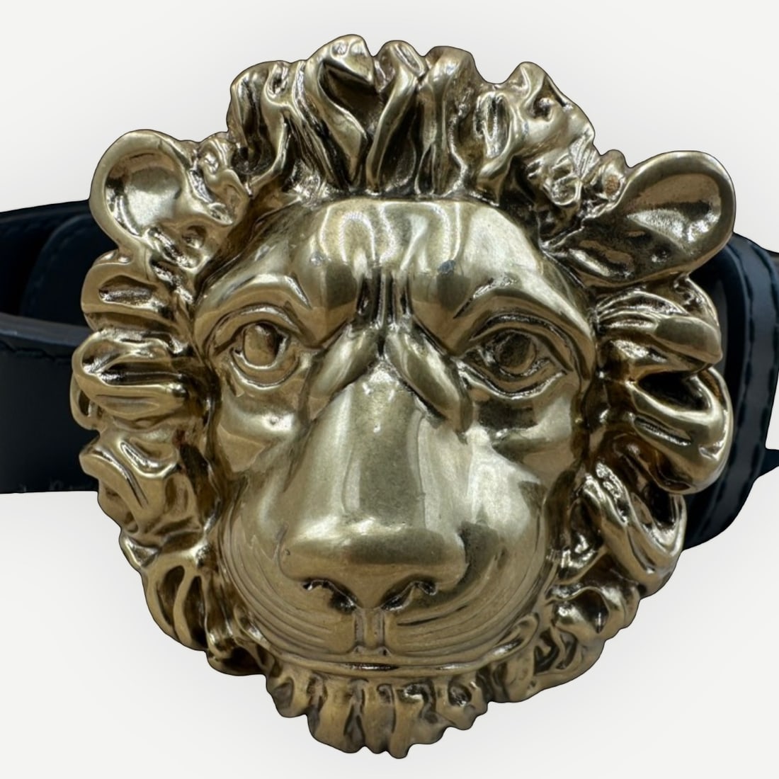 GUCCI Lion Head Buckle Belt, Black Leather, Gold-Tone Hardware, With Original Dust Bag: A striking expression of GucciÕs bold design language, this black leather belt is distinguished by its sculptural lion head buckle rendered in polished gold-tone metal. The lion motif has become 
